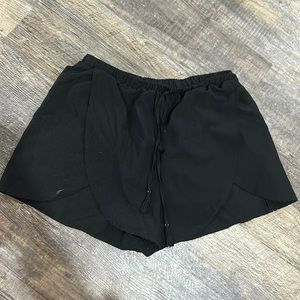 Black fashion shorts, with small “slits”